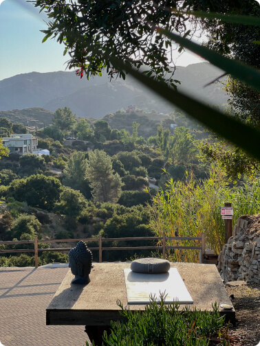 topanga green mountains and meditation stone platform with buddha head