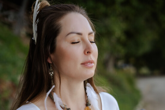 brown haired girl doing meditation with closed eyes