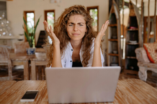 girl seats in front of a computer