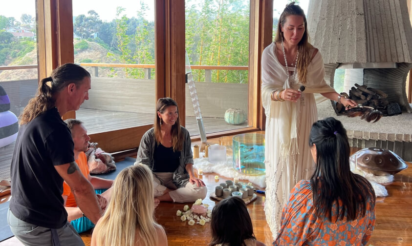 group of girls are seating in circle preparing to play leela game