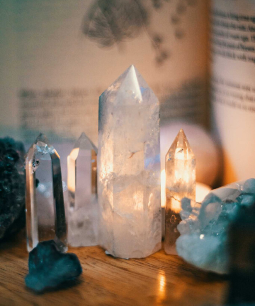 spiritual crystals standing on a wooden desk