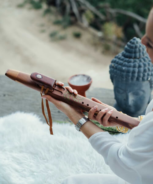 girl is playing meditation musical instrument