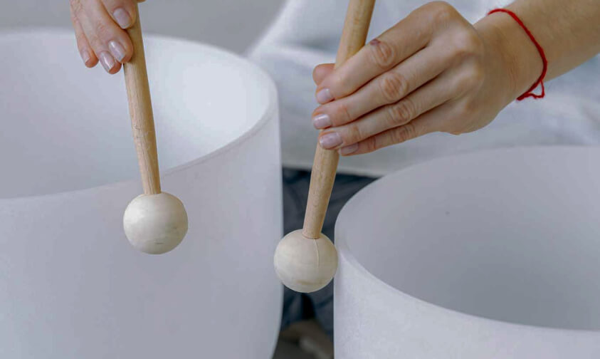 two drum sticks for playing sound healing bowls