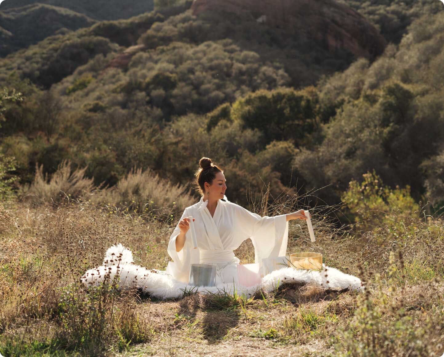 girl in the nataure doing sound healing session